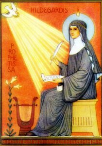 sainte Hildegarde de Bingen en train de recevoir des visions de l'Esprit-Saint, baignée dans une grande lumière avec plume à la main